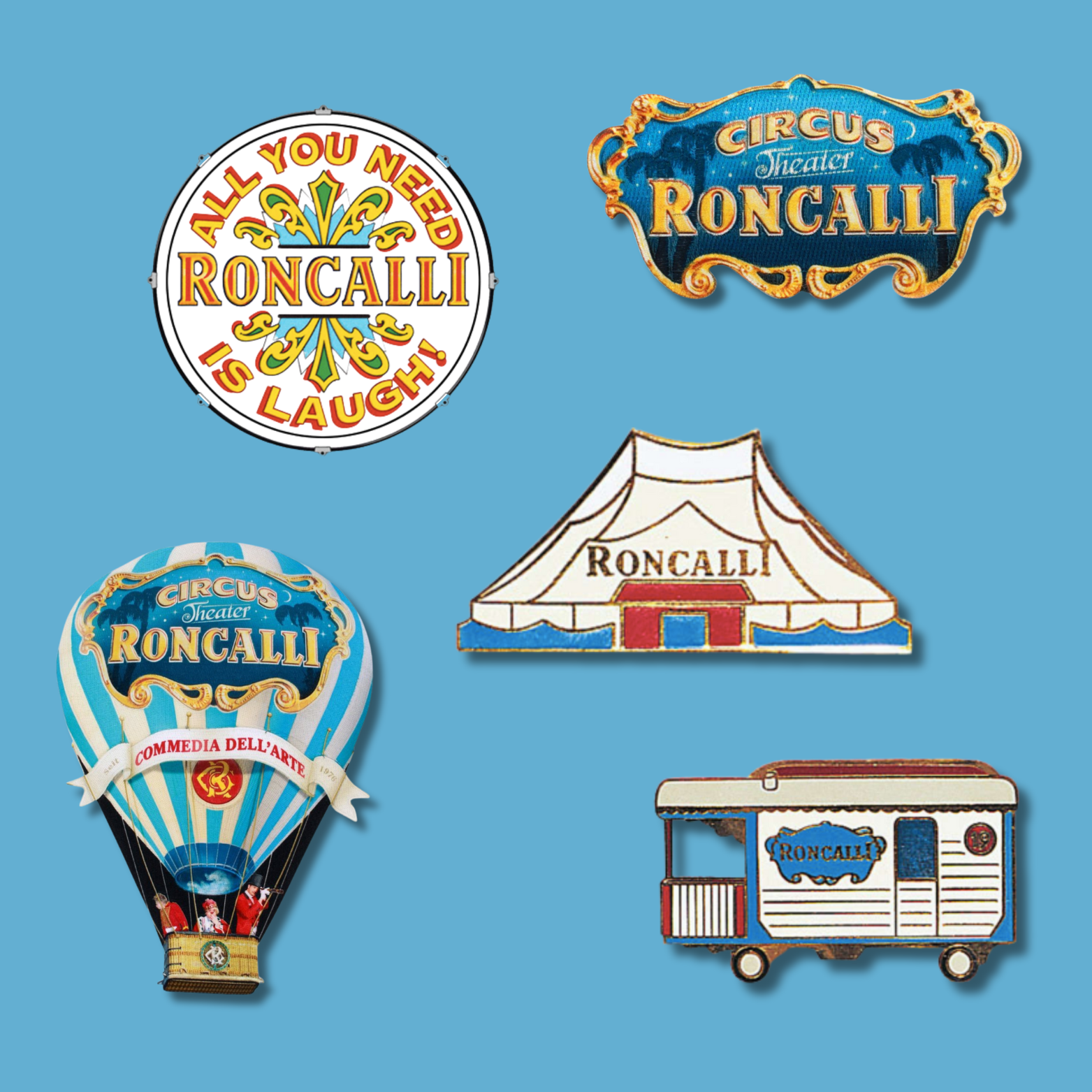 Verschiedene Roncalli-Pins und Aufnäher mit Zirkusmotiven wie Heißluftballon, Zelt und Wohnwagen.