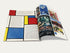 Offenliegendes Roncalli-Programmheft mit buntem Design im Mondrian-Stil und Fotocollagen zur Zirkusgeschichte.